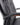 Close-up of Belair High Back Leather Executive Office Chair featuring black leather upholstery, padded backrest and curved armrests with metallic trim.